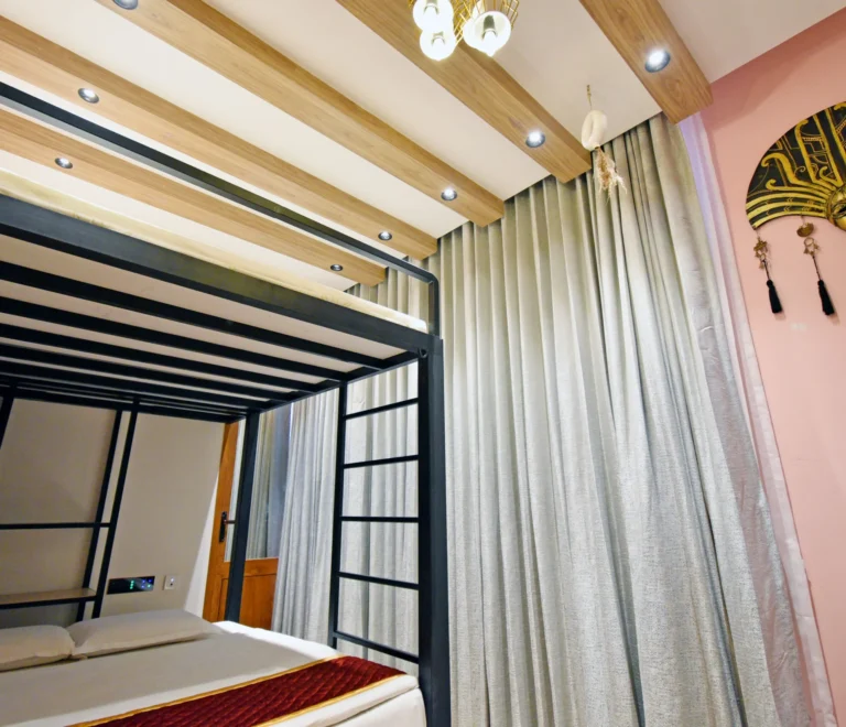 Room-303-–-Mediterranean-Pink-Bunk-A-Seaside-Sanctuary