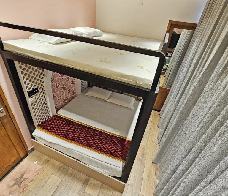 Room-303-–-Mediterranean-Pink-Bunk-A-Seaside-Sanctuary